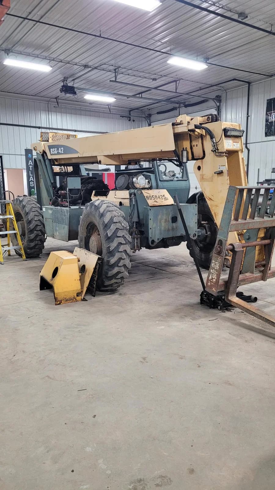 Equipment in the TerBeest workshop with removed parts nearby