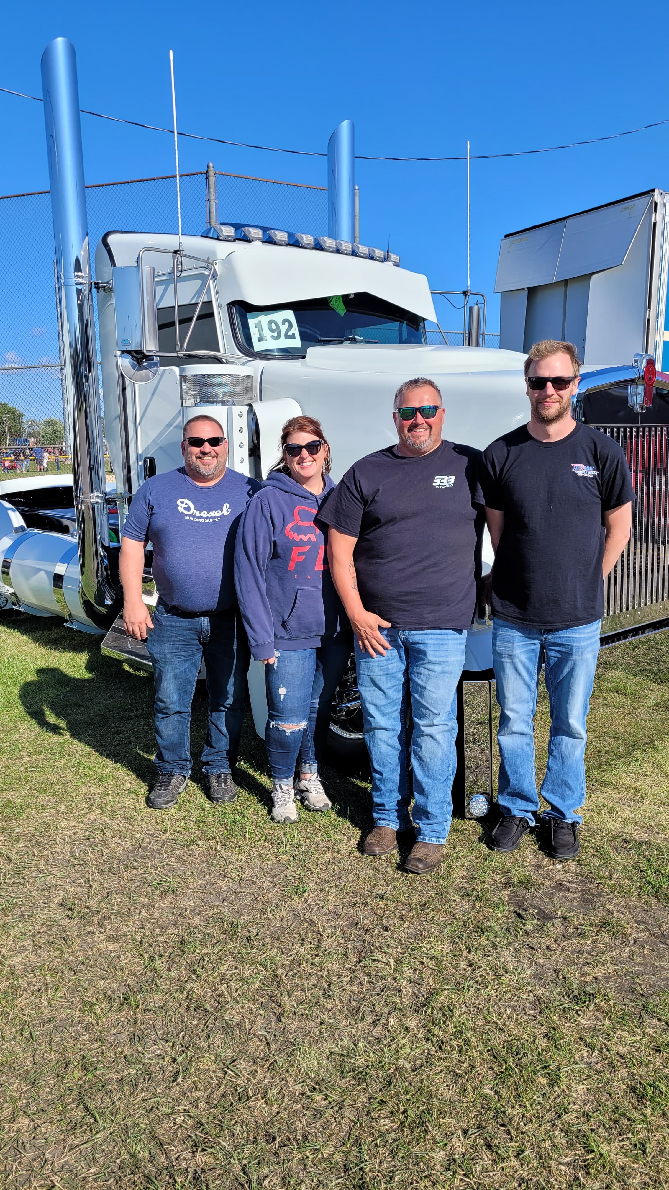 Visitors beside the white show truck that Mike helped work on